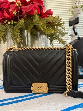 Authentic CHANEL Black Quilted Chevron Boy Bag with Gold Hardware